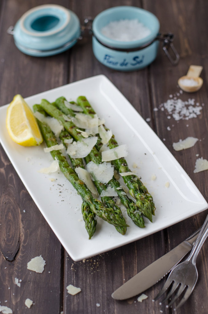 Grilled asparagus is green asparagus shortly boiled and then grilled with olive oil, served with salty crystals "fleur de sel" and parmesan.