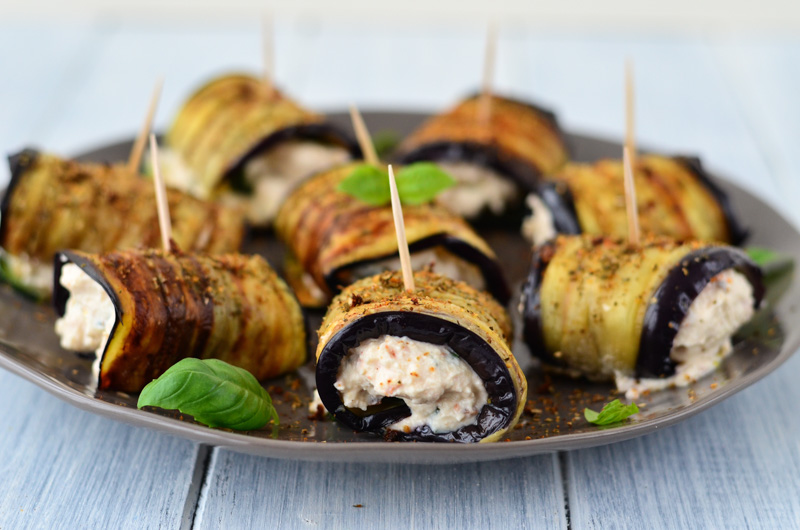Grilled Aubergine and Courgette Rolls filled with a mixture of cheese, sundried tomatoes, lemon, and basil are ideal as a summer vegetarian appetizer.