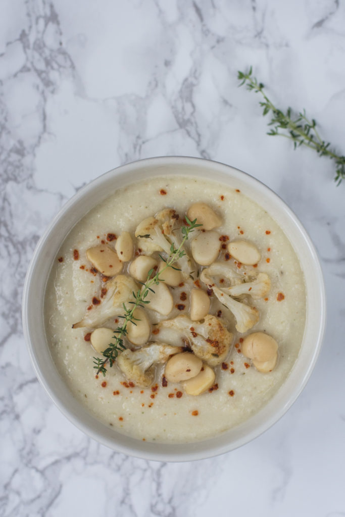 This Roasted Cauliflower Soup is dense and creamy with a taste of garlic, spices, and thyme. The recipe is vegan as I used almond milk instead of cream.